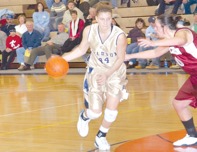 Heather playing basketball in high school